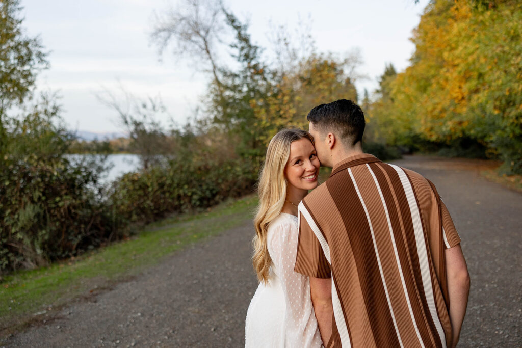 couple outside posing for engagement photos
