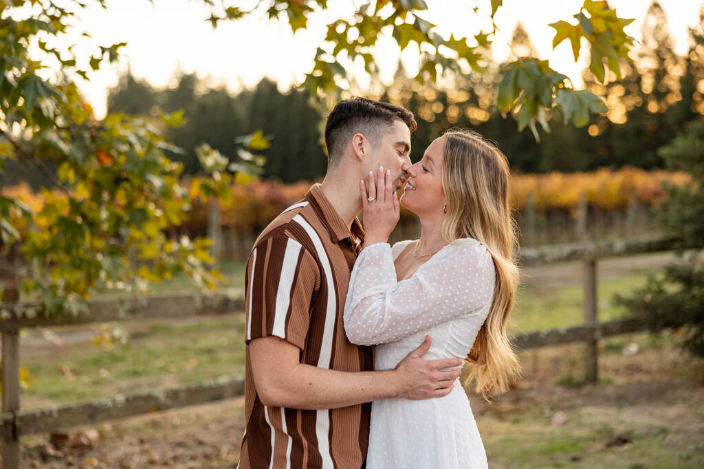 couple outside posing for engagement photos
