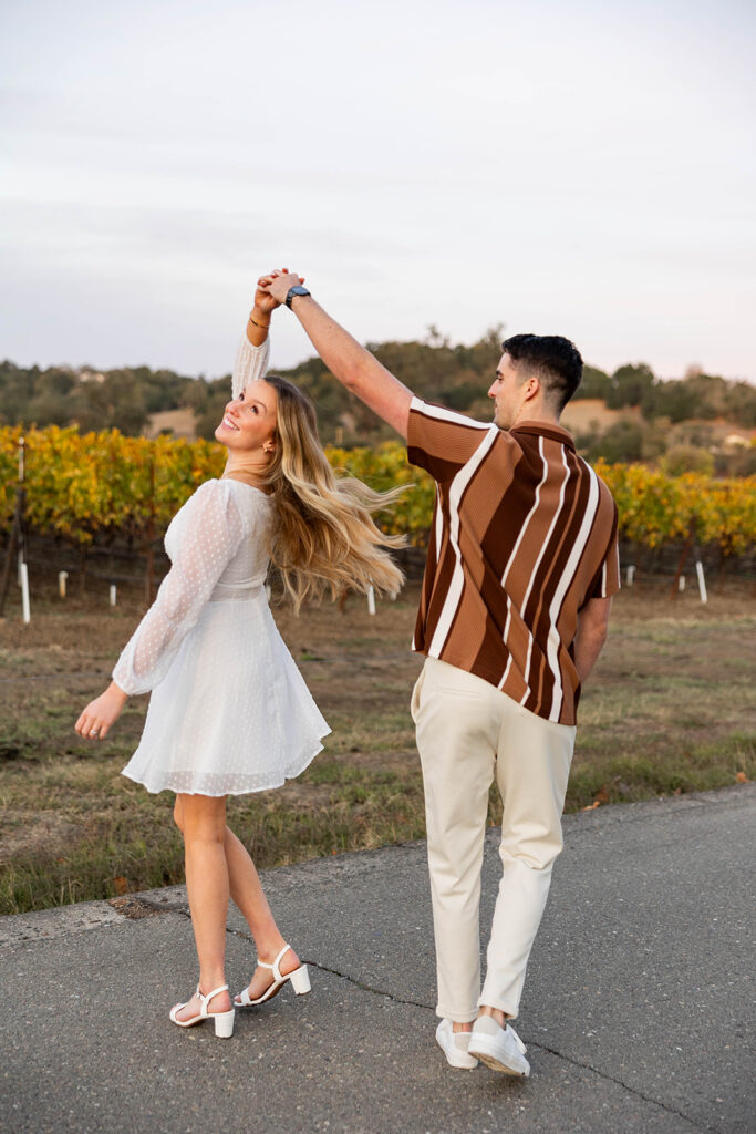 couple outside posing for engagement photos