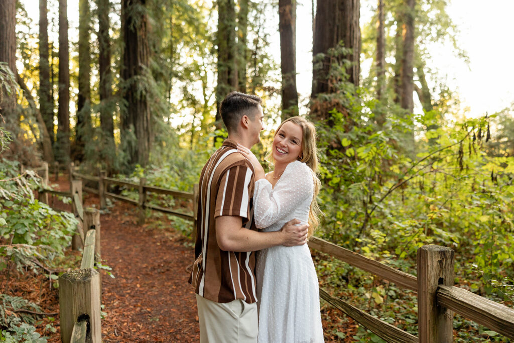 couple outside posing for engagement photos
