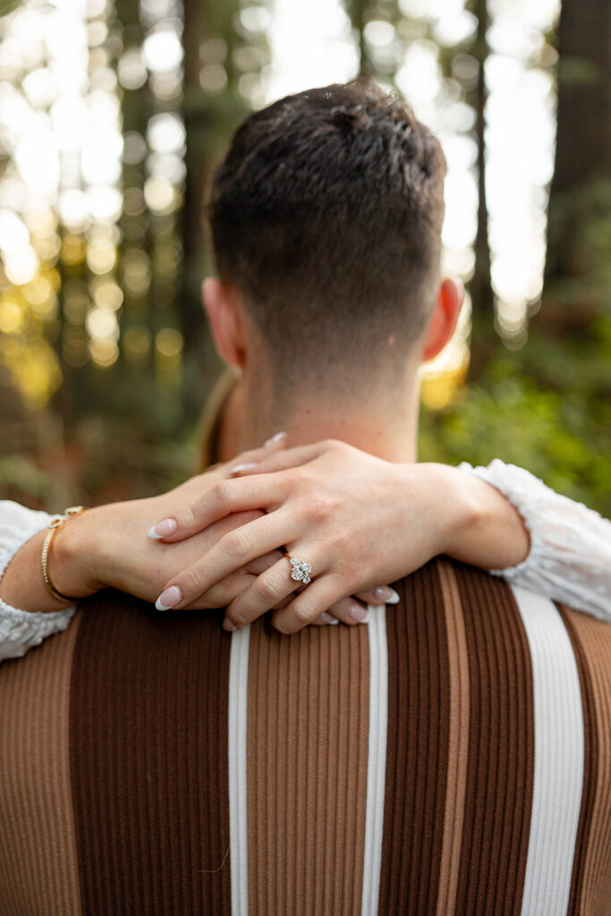 couple outside posing for engagement photos
