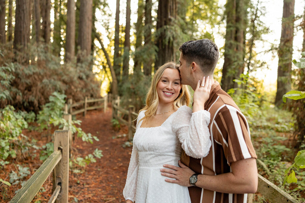 couple outside posing for engagement photos
